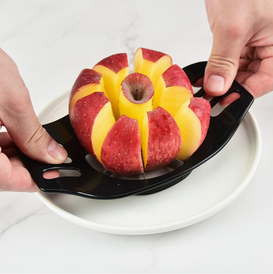Black apple corer slicer holding an apple with vertical segmented slices