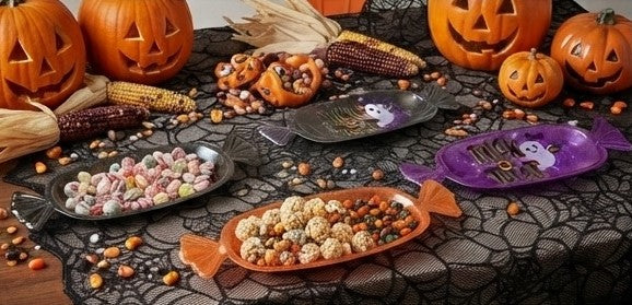 Fish-shaped Halloween candy serving tray with Trick or Treat purple design