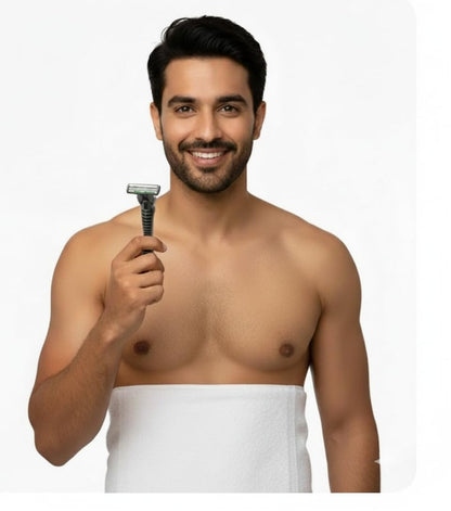 Men's triple-blade razor held in hand with detachable head
