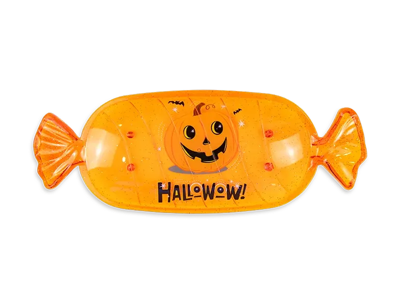 Orange fish-shaped Halloween candy serving tray with smiling jack-o-lantern and Halloween text