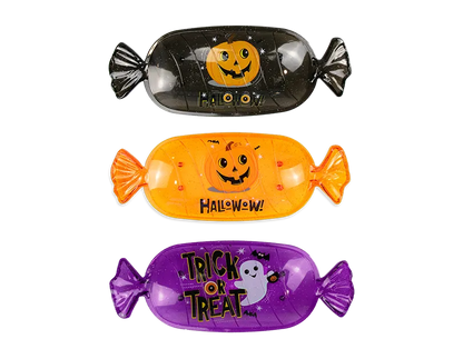 Black fish-shaped Halloween candy serving tray with jack-o-lantern face and Halloween text