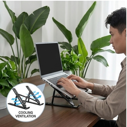 Black portable adjustable laptop stand supporting a laptop on a desk