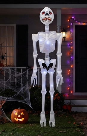 Tall inflatable white skeleton decoration with red-eyed skull and glowing chest LEDs